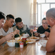 Workers enjoy their dinner in the onsite dining hall.